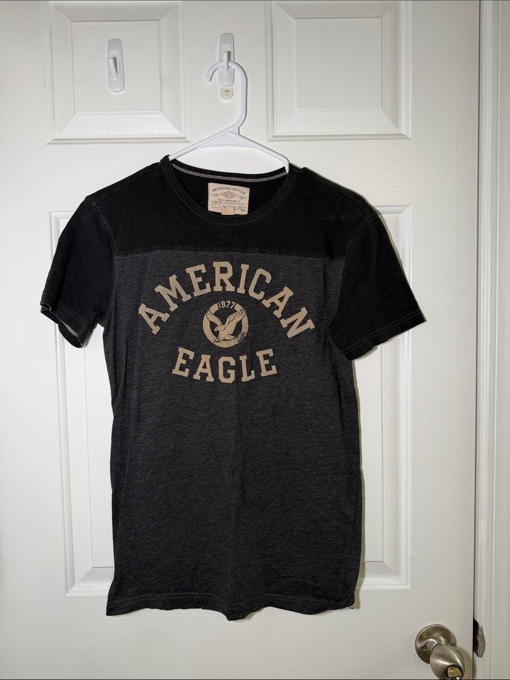 American Eagle Outfitters Black Tee with Tan Logo Graphic